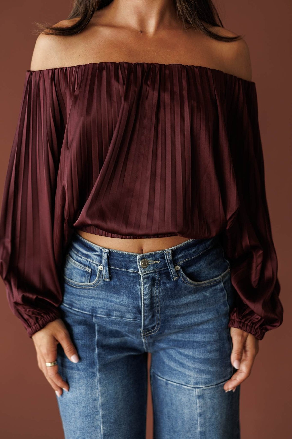 Wine Pour Off Shoulder Top, in wine, front view of the pleated blouson sleeves with denim