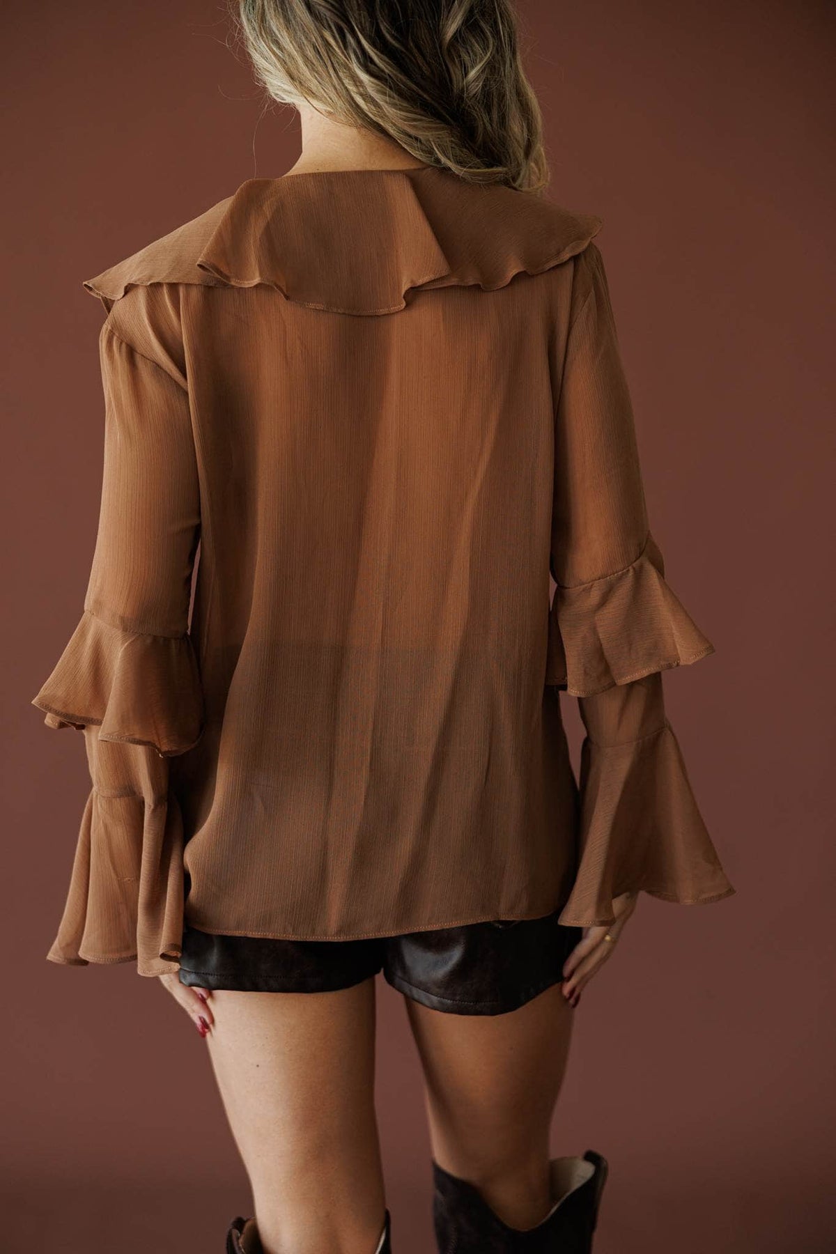 Heirloom Ruffle Blouse in chocolate, back view showing the sheer chiffon and ruffle cuffs