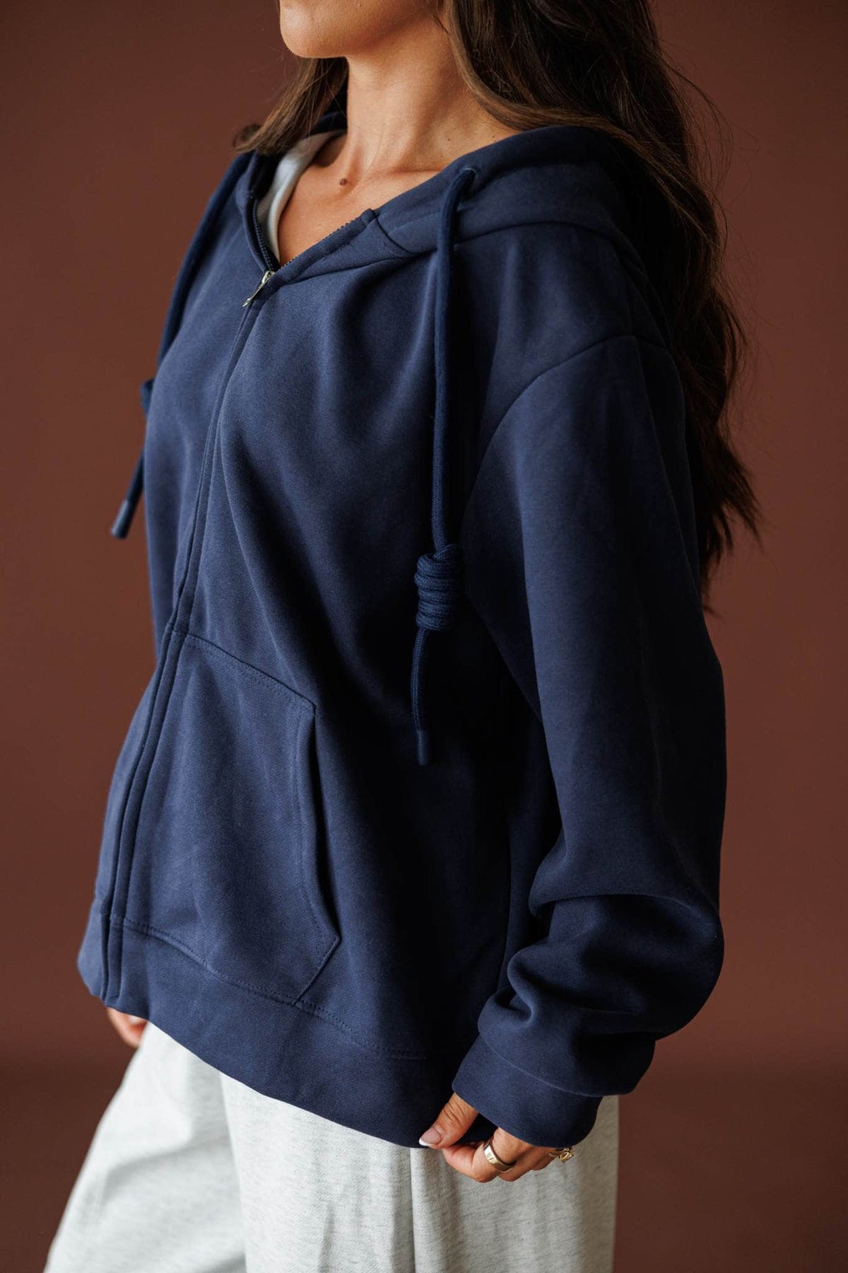 On Standby Zip Up Jacket in navy, side view of the oversized fit