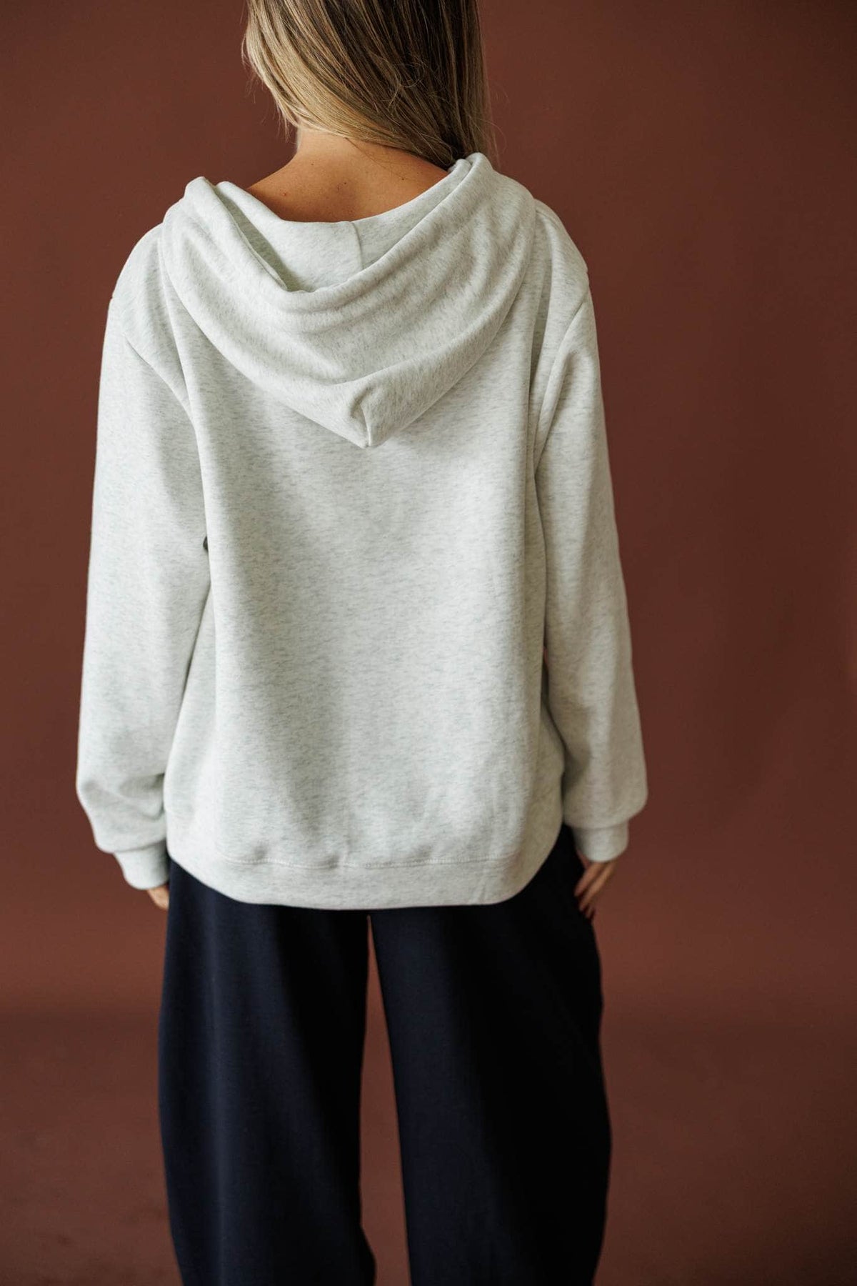 On Standby Zip Up Jacket in light heather grey, back view showing the hood