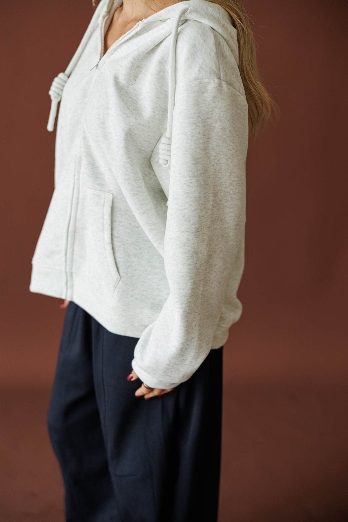 On Standby Zip Up Jacket in light heather grey, side view of the oversized fit