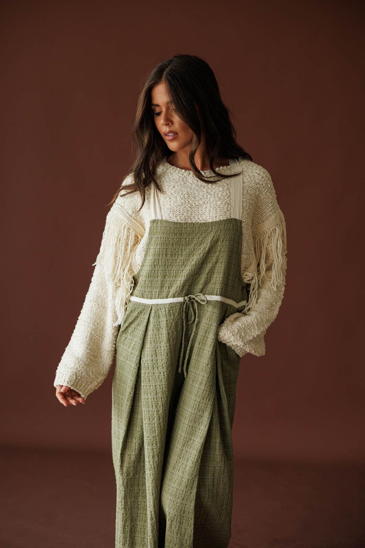 Field Trip Overalls in olive, front view of the drawcord waist