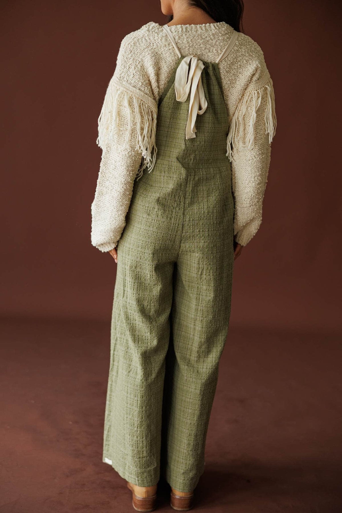 Field Trip Overalls in olive, back view of the tie straps