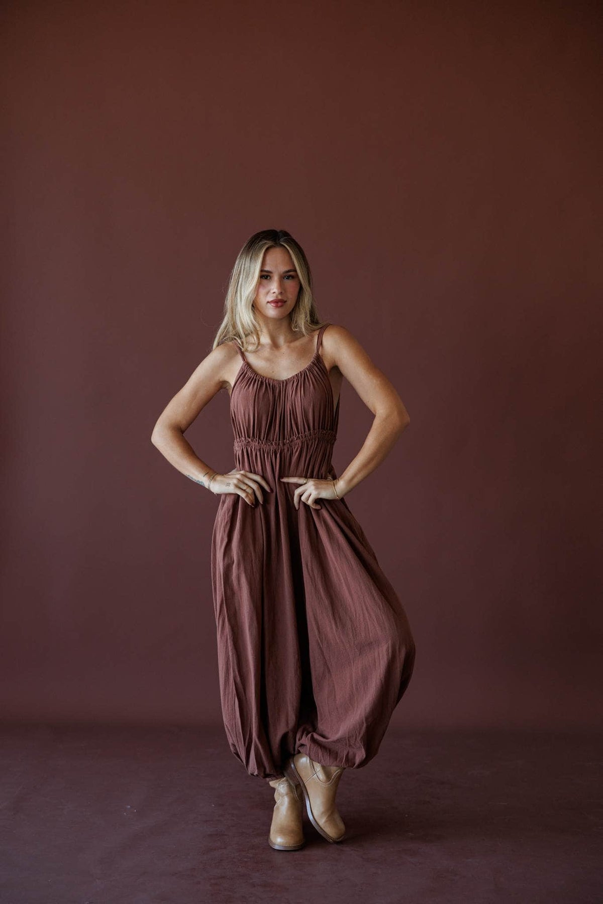 The Roam Jumpsuit, in brown, front view of the gathered bodice