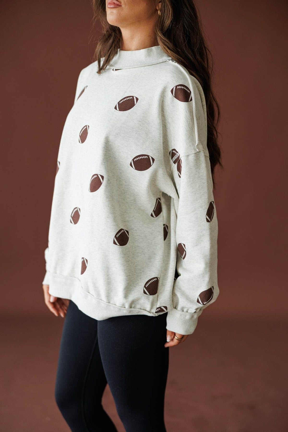 Double Down Reversible Sweatshirt in heather grey, side view of the football print side and drop shoulder