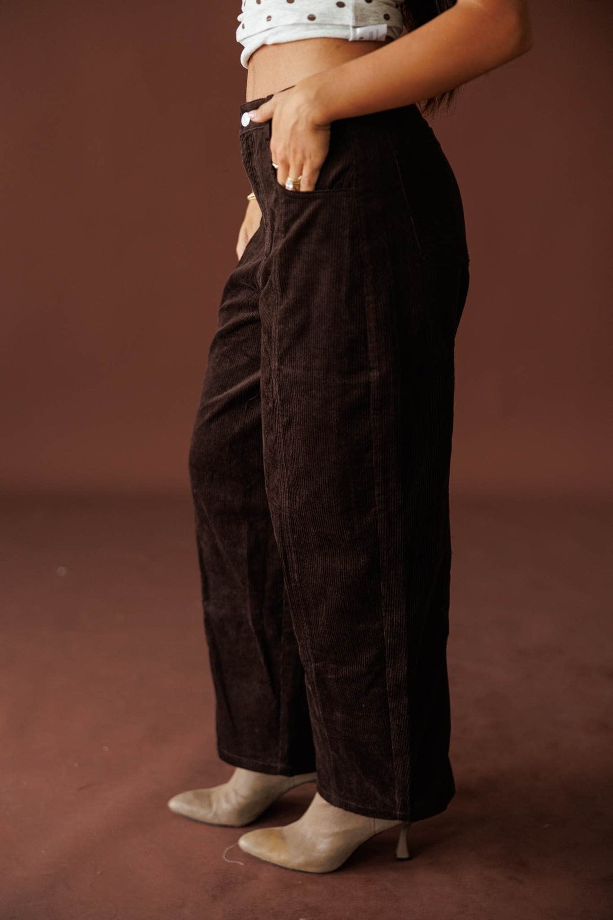 Bookshop Corduroy Barrel Pants in dark chocolate, close view of the high waist and front pockets