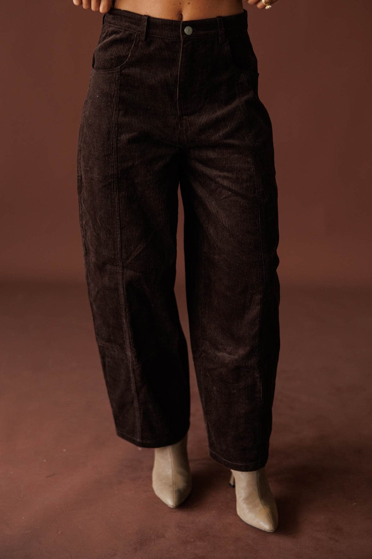 Bookshop Corduroy Barrel Pants in dark chocolate, front view of the barrel leg with booties