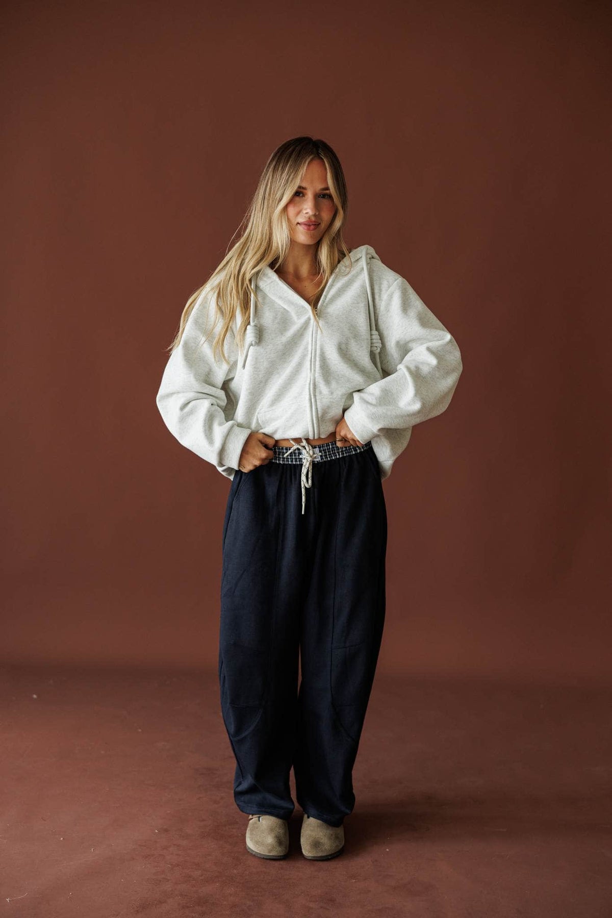 Slow Down Wide Leg Joggers in navy, full-length view with a cream zip up jacket