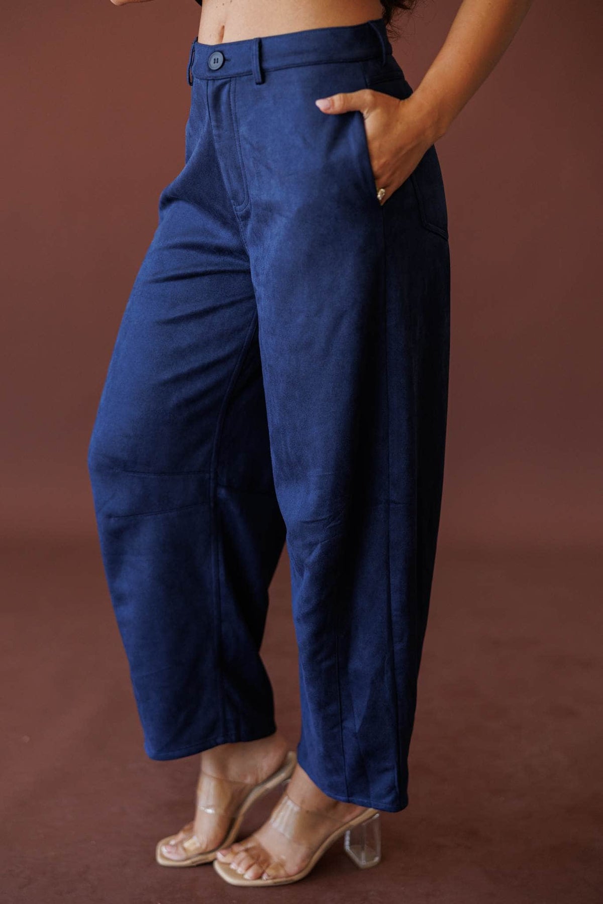 Suede Society Barrel Pants, in navy, side view of the curved barrel leg