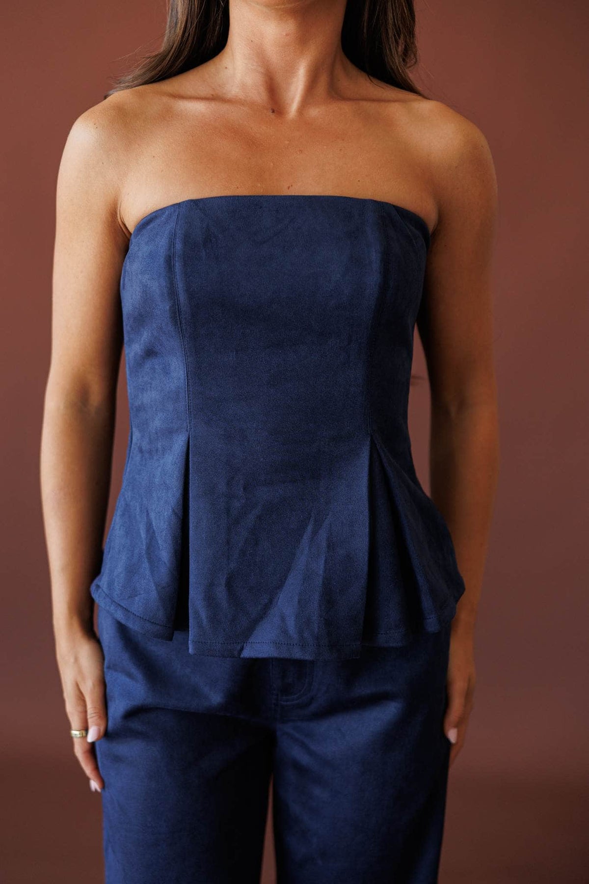 Suede Society Strapless Top, in navy, front view of the pleated flare