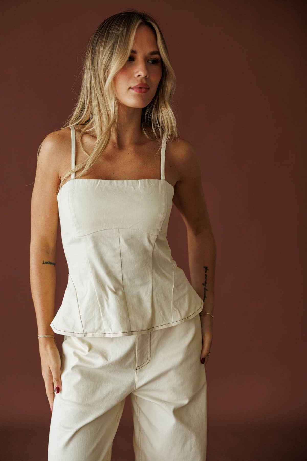 Roadhouse Peplum Top in cream, front view of the straight neckline and peplum hem