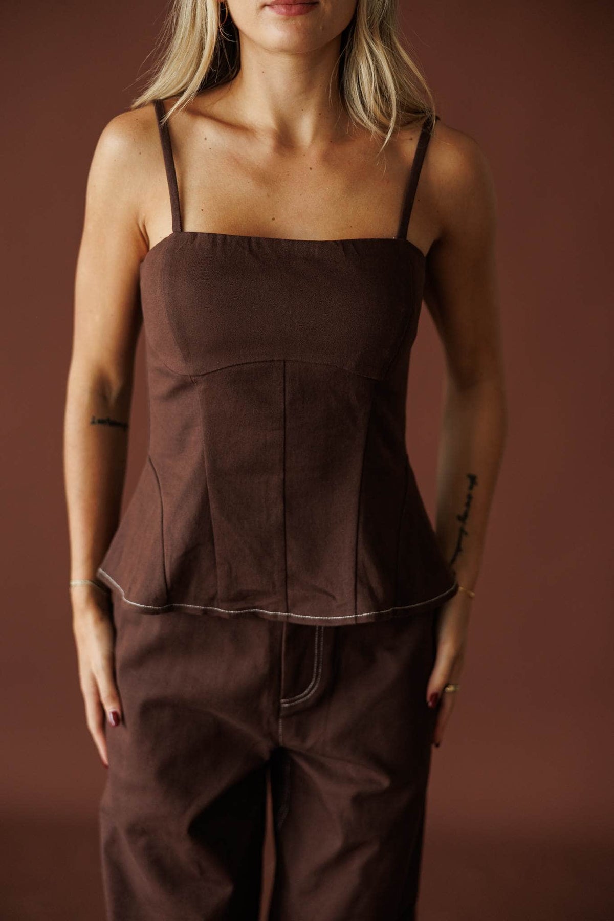 Roadhouse Peplum Top in brown, front view of the seamed bodice and peplum