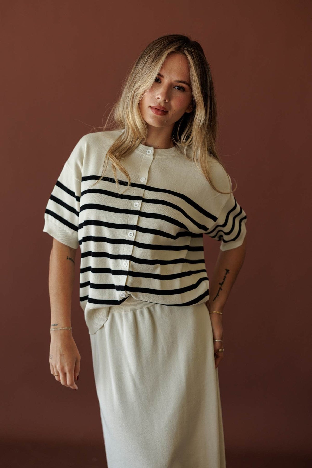 Collins Stripe Cardigan, in cream, three-quarter front view with the knit maxi skirt