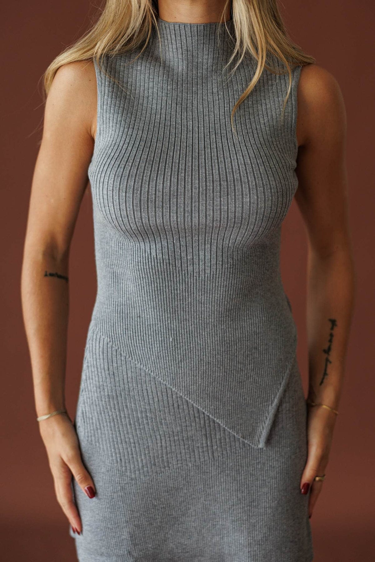 West Village Top in heather grey, front view of the ribbed mock neck and asymmetric seam