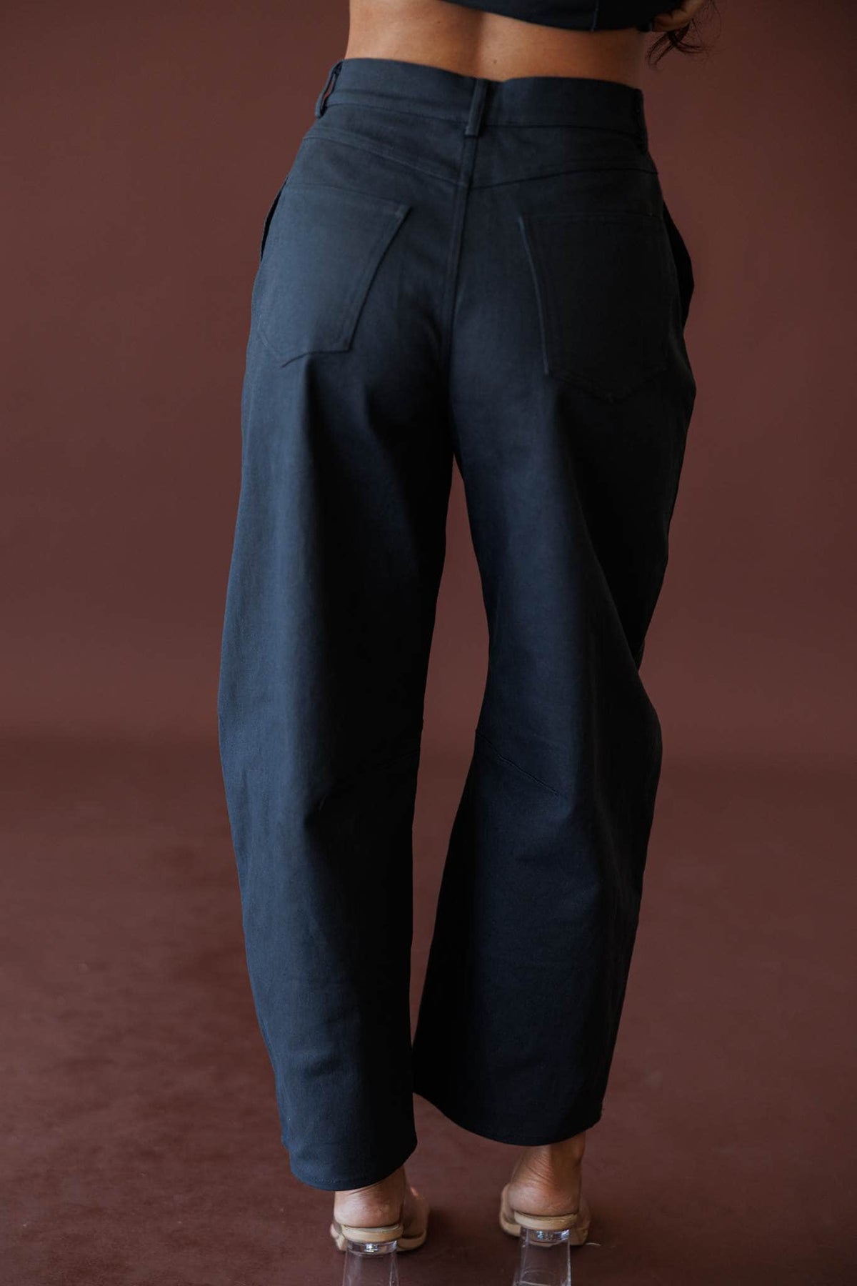 The Regent Barrel Pants, in navy, back view of the barrel pants