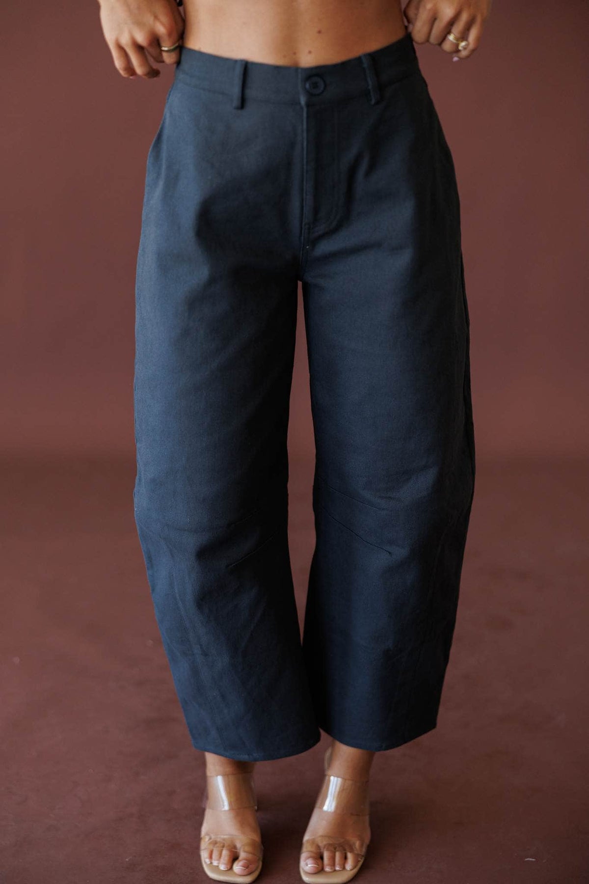 The Regent Barrel Pants, in navy, front view of the barrel leg pants
