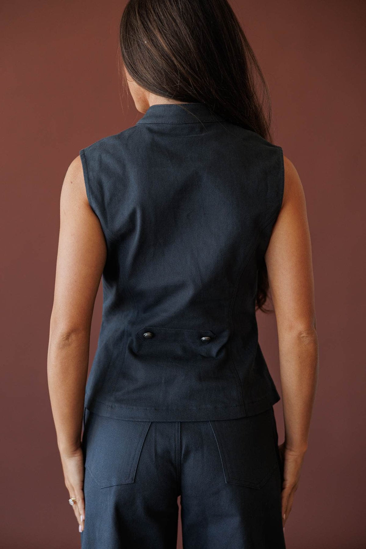 The Regent Vest, in navy, back view of the military vest