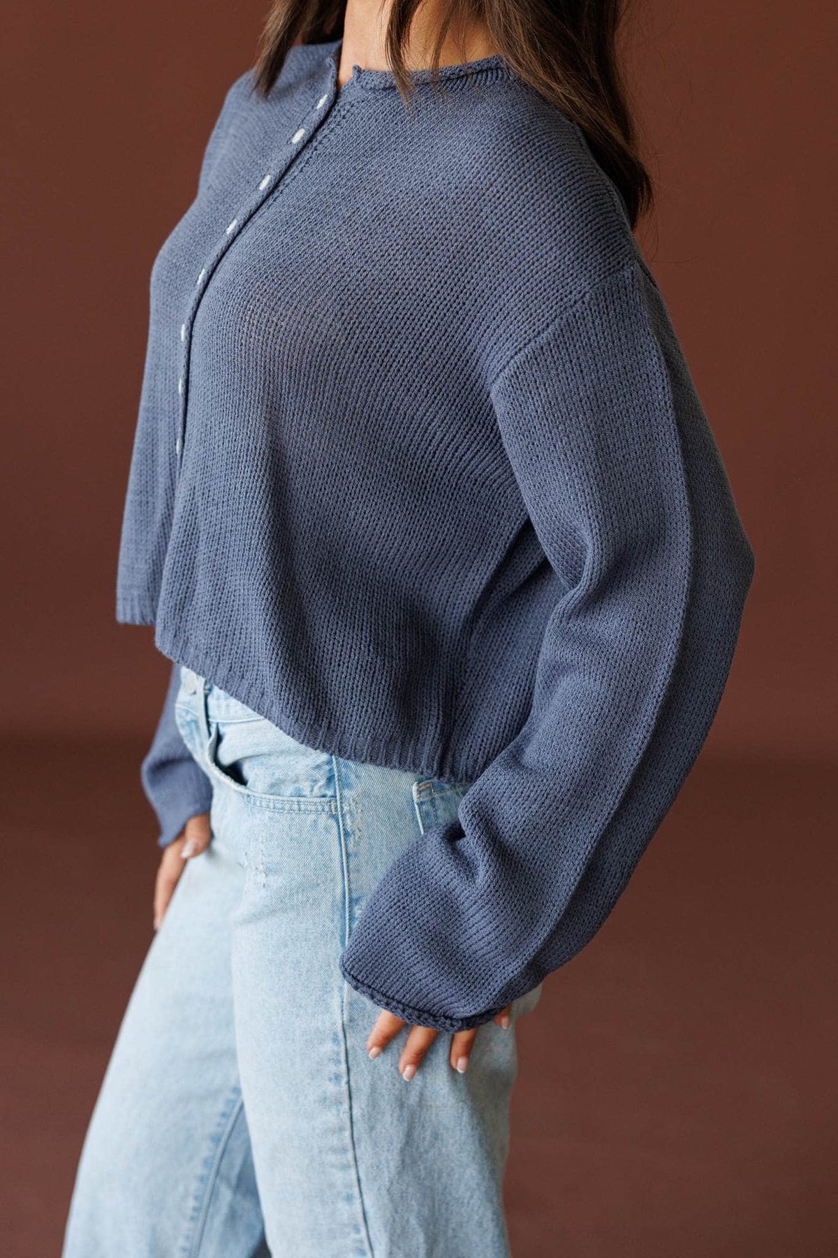 Common Ground Cardigan in nightfall, side view showing the balloon knit sleeve