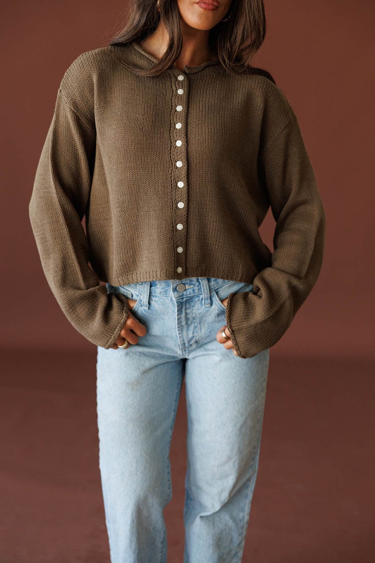 Common Ground Cardigan in olive, front close-up of the button front and knit collar