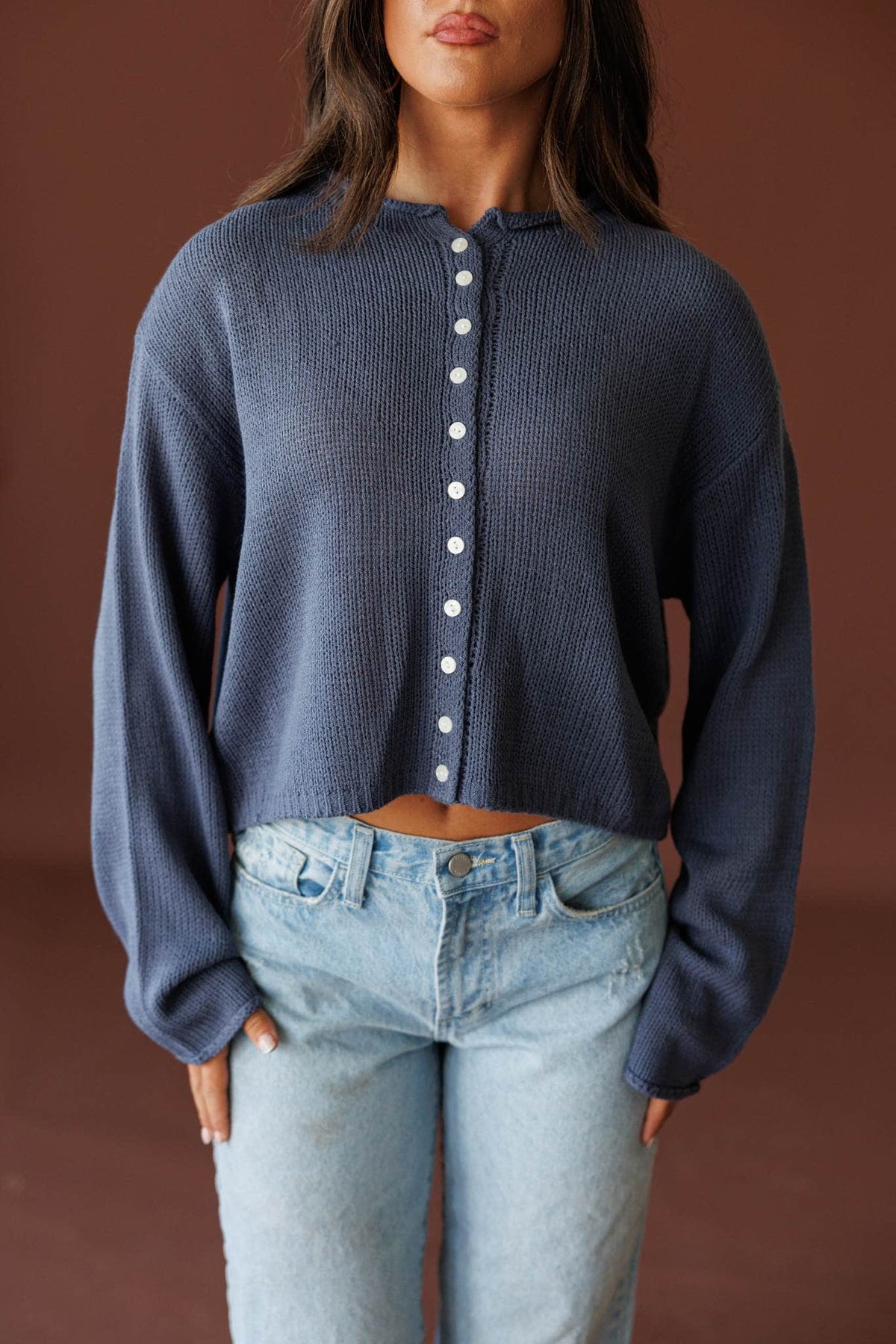 Common Ground Cardigan in nightfall, front close-up of the button front and knit collar