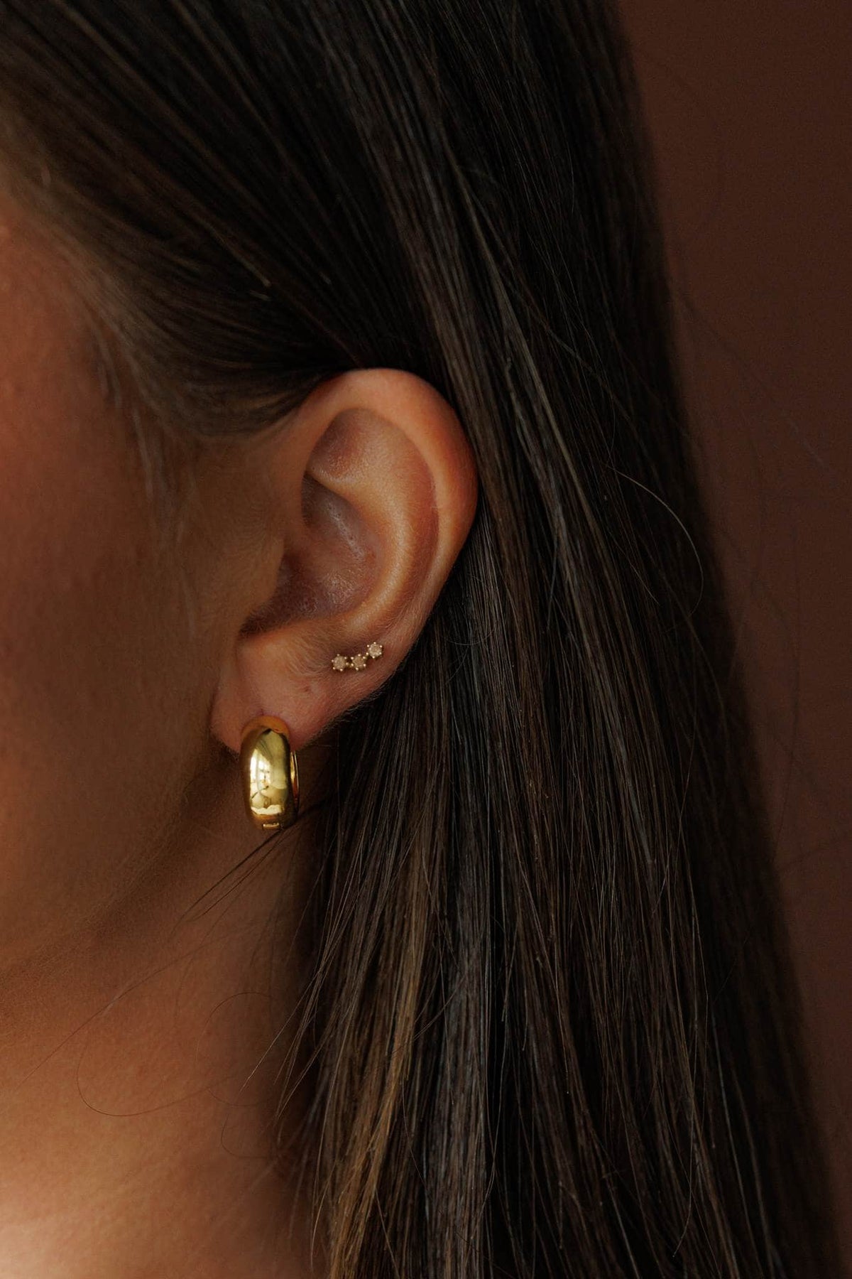 Crescent Dome Earrings, worn on the ear
