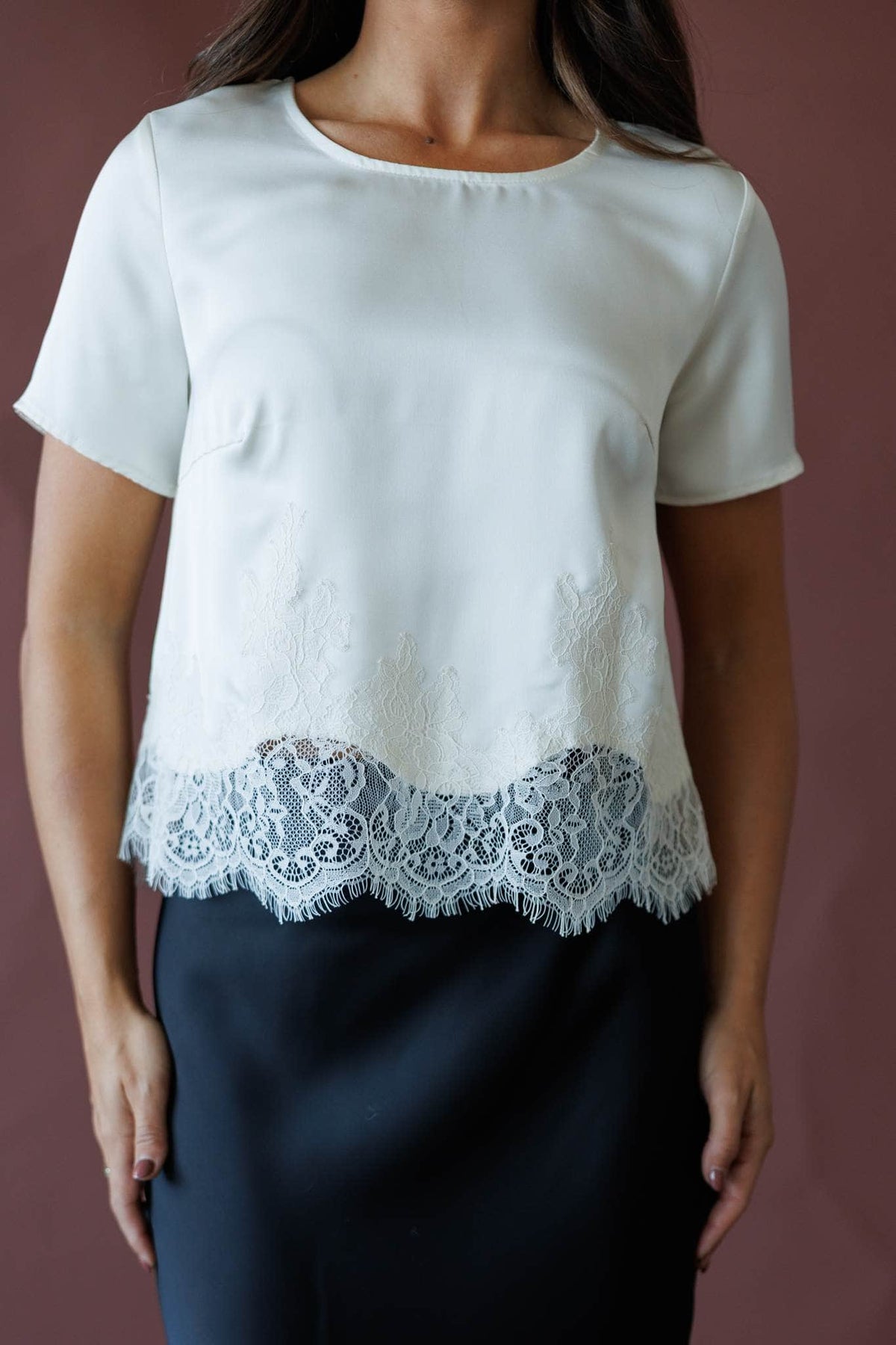 Cream short sleeve top with lace hem