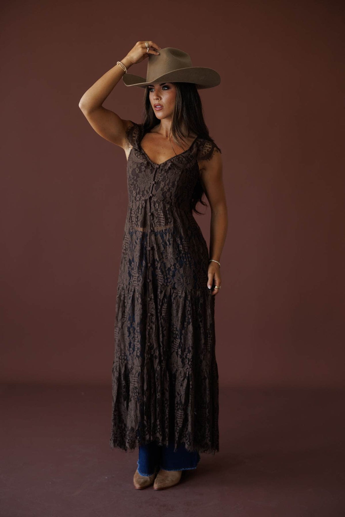 Lace Trail Maxi Top in chocolate, full-length view on model adjusting the hat brim