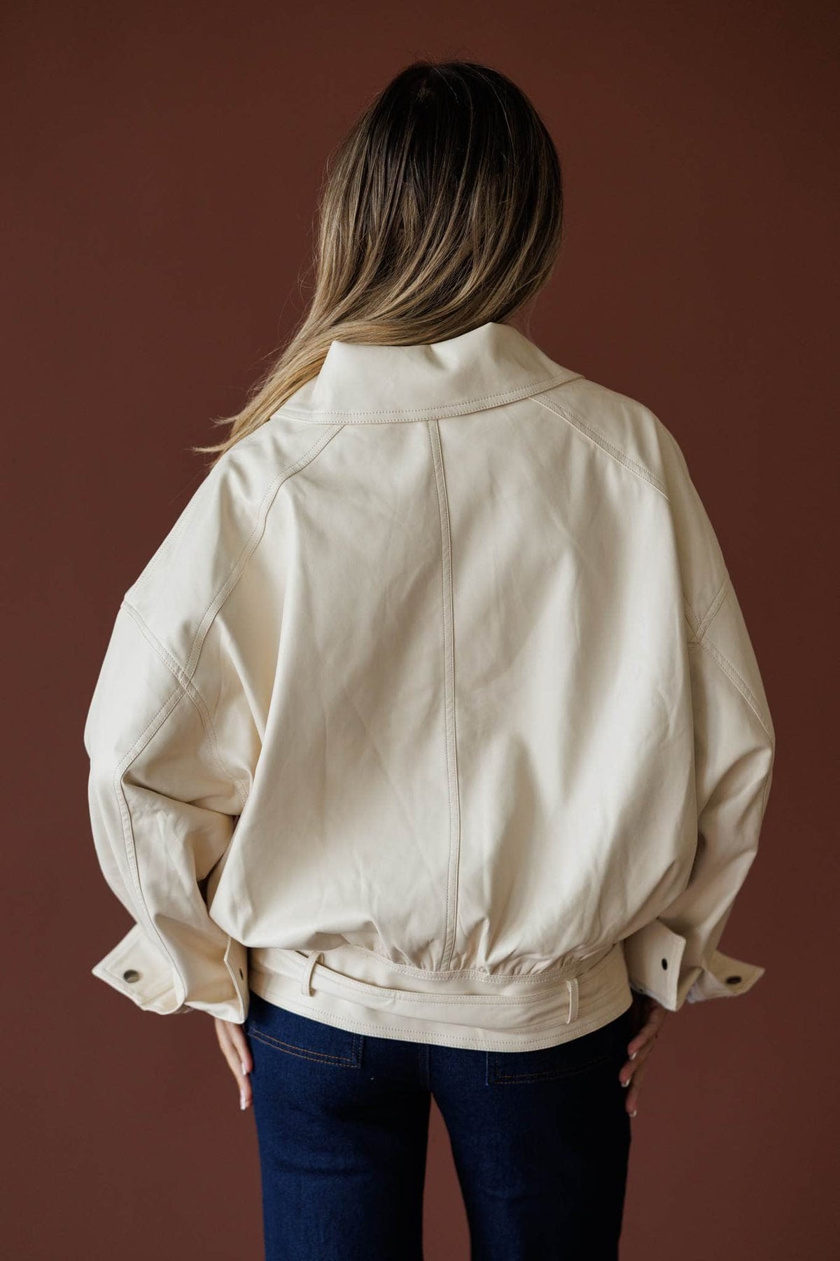 The Waypoint Jacket in cream, back view showing the oversized bomber jacket
