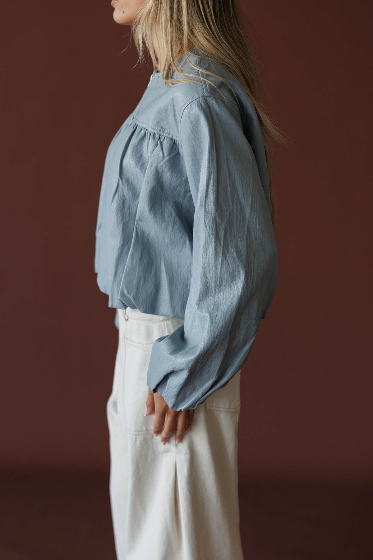 Daily Edition Jacket in fog blue, side view showing the balloon sleeve and cropped hem