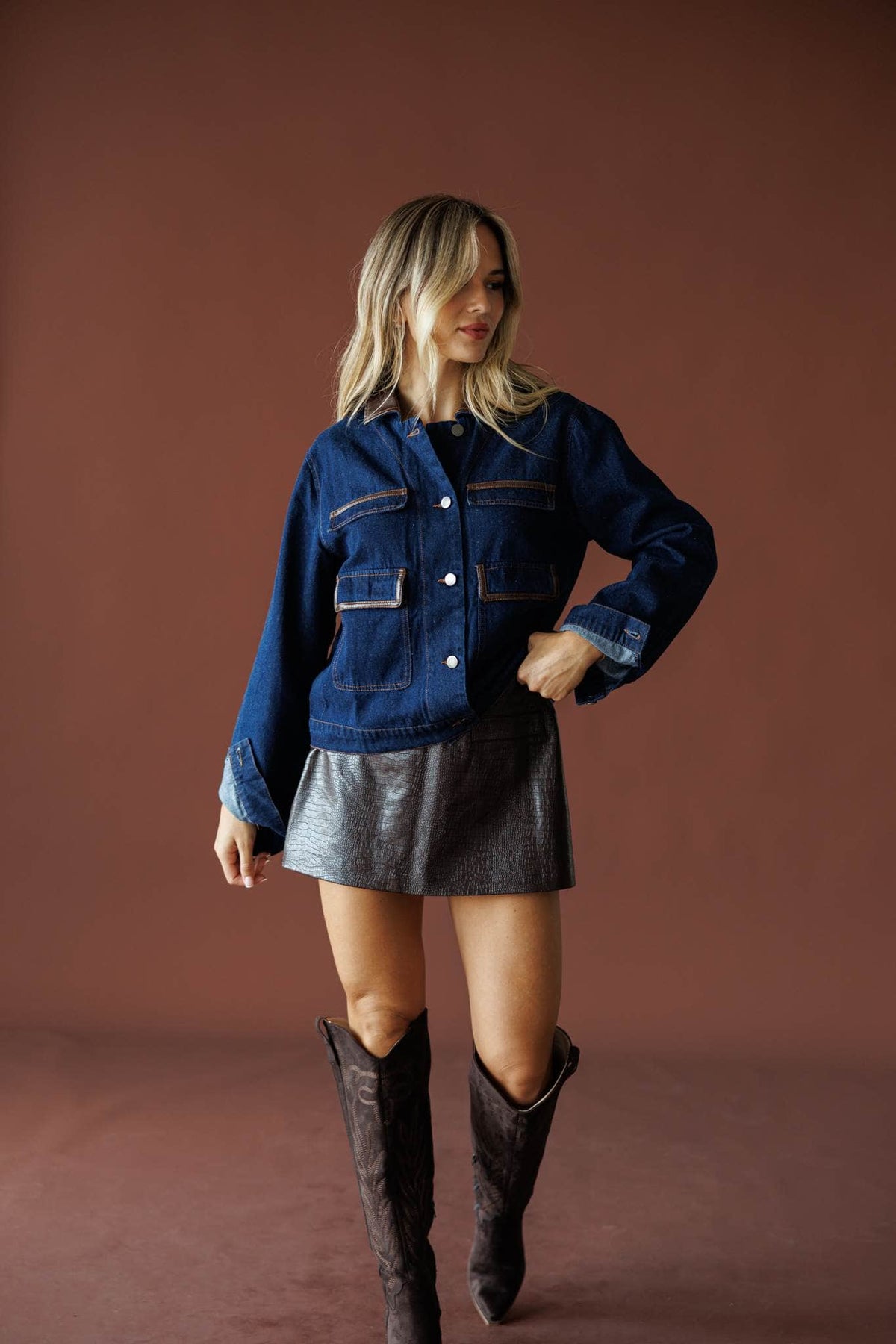 On Location Denim Jacket in medium denim, full-length view with a metallic mini skirt