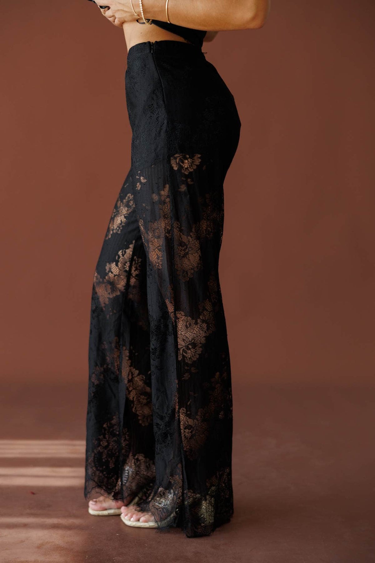 Love Letters Lace Pants in black, side close-up showing the high waist and lace