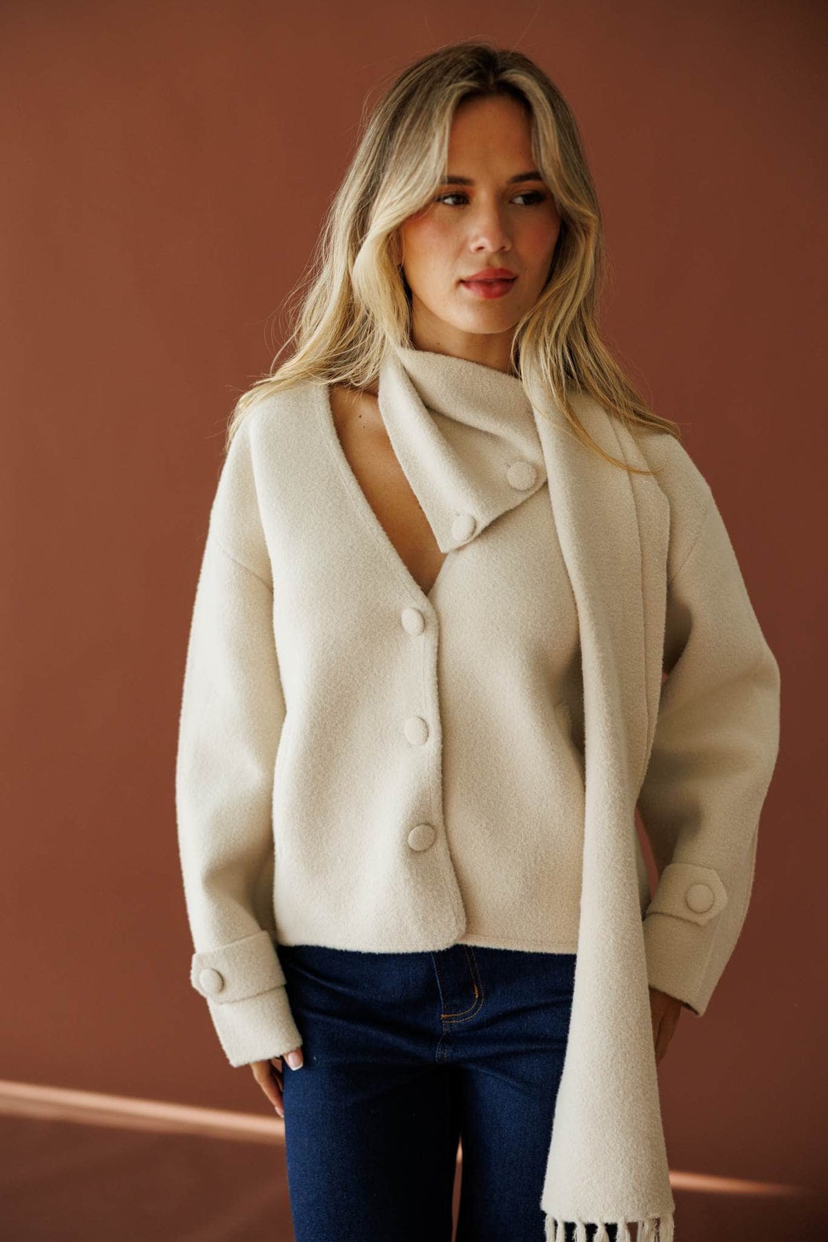 November in New York Sweater in beige, front view on model with the scarf draped