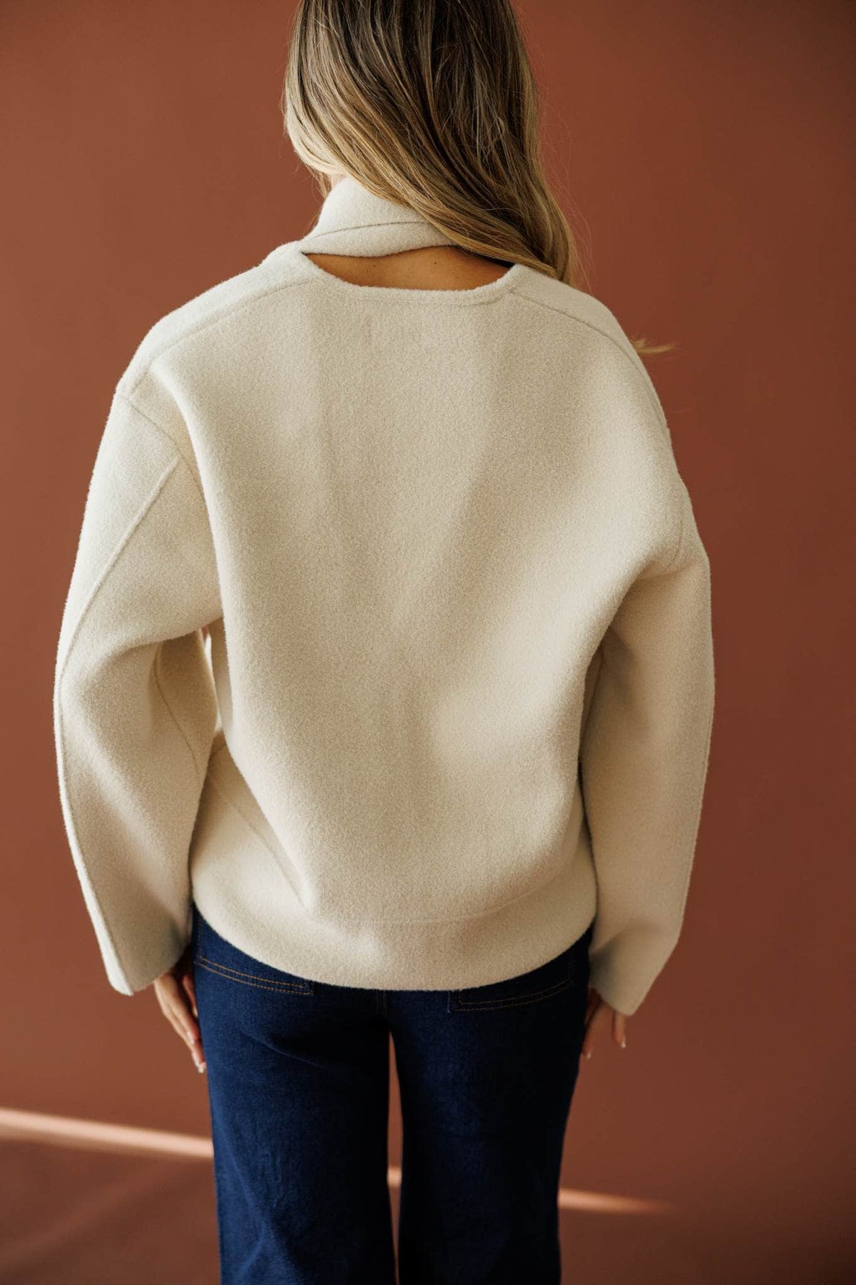November in New York Sweater in beige, back view showing the boxy wool knit