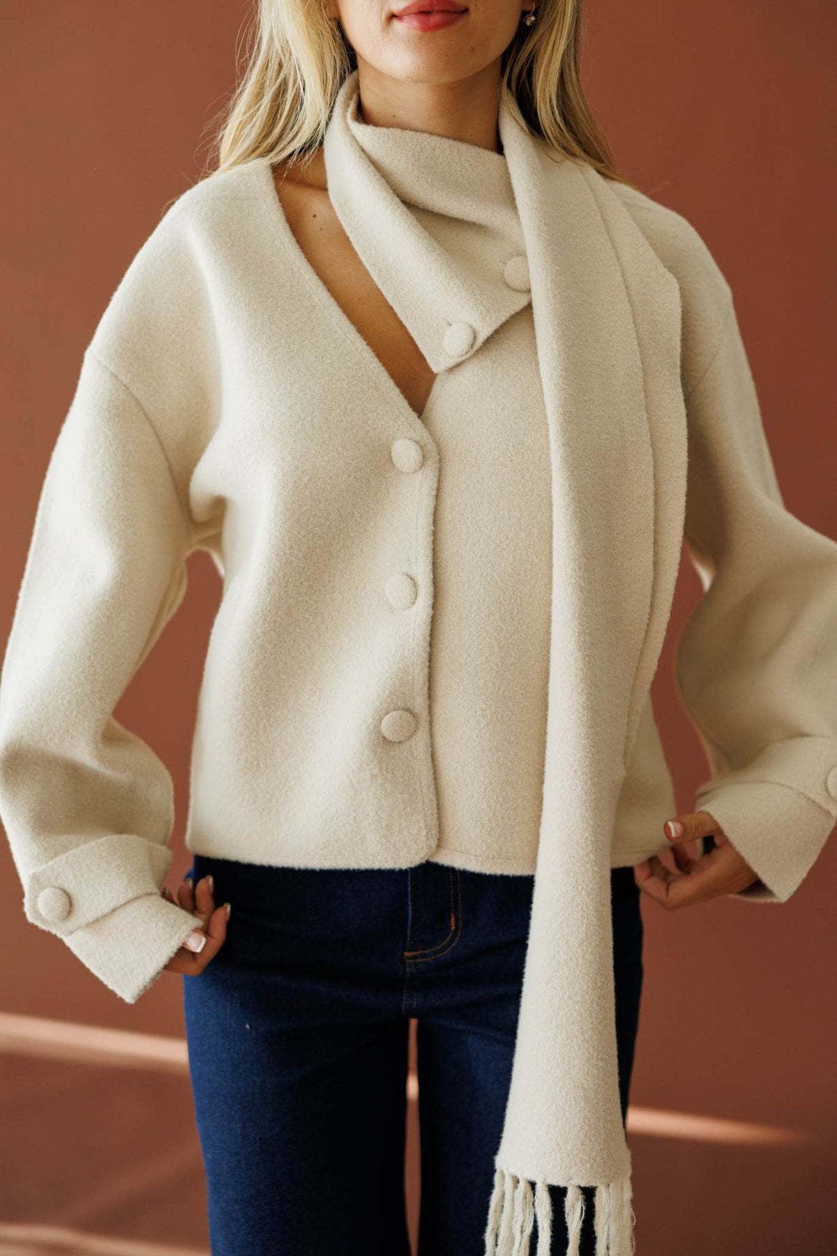 November in New York Sweater in beige, front close-up of the button front and scarf