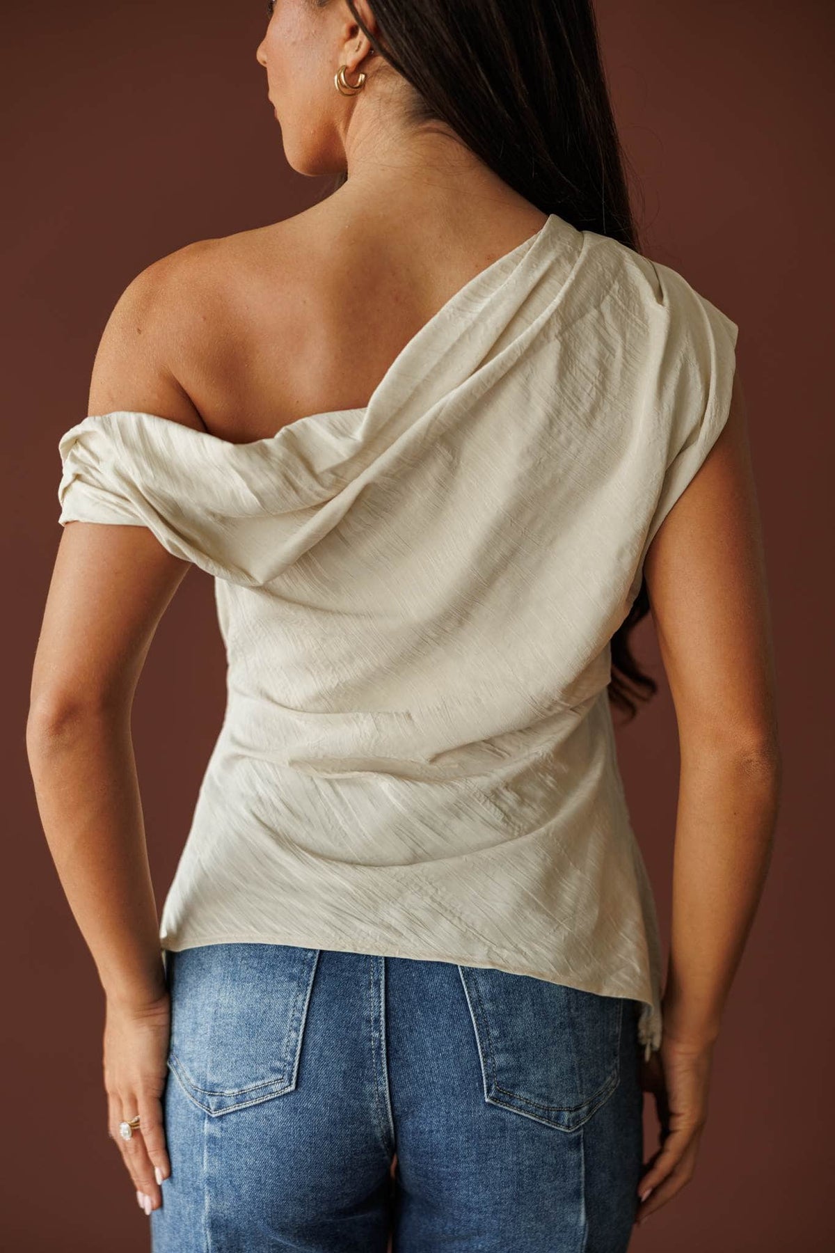 Draped one shoulder top in beige