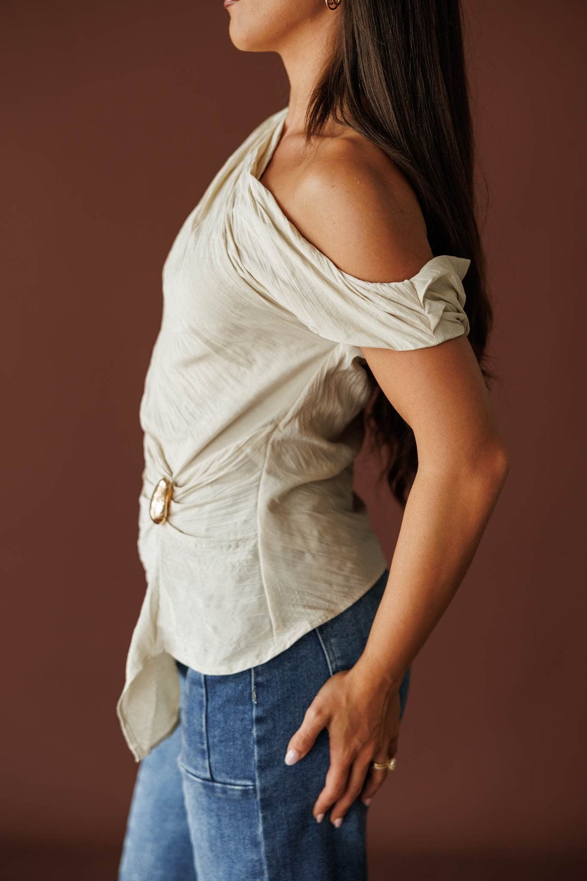 Draped one shoulder top in beige