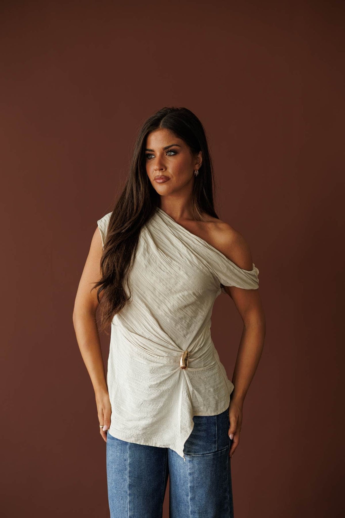 Draped one shoulder top in beige, front view