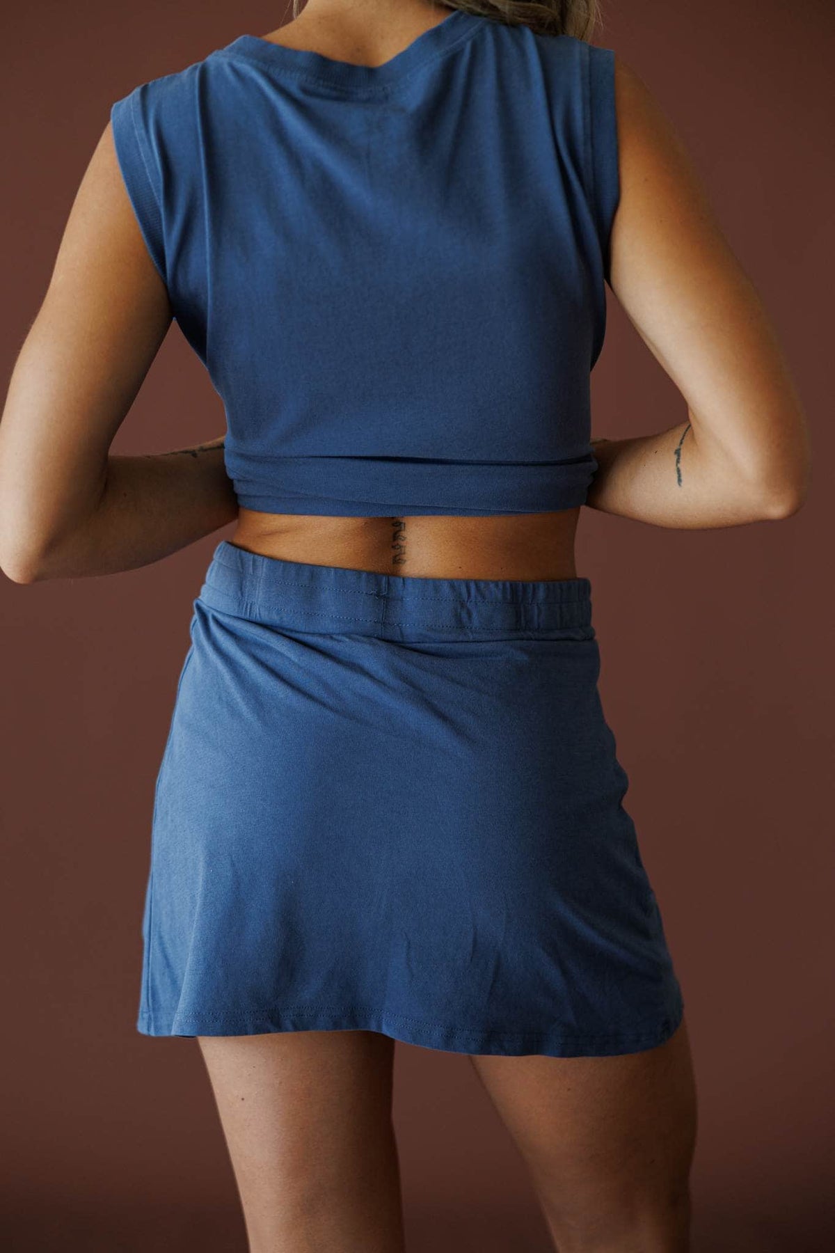 Morning Lineup Skort in ocean, back view showing the elastic waist and skort