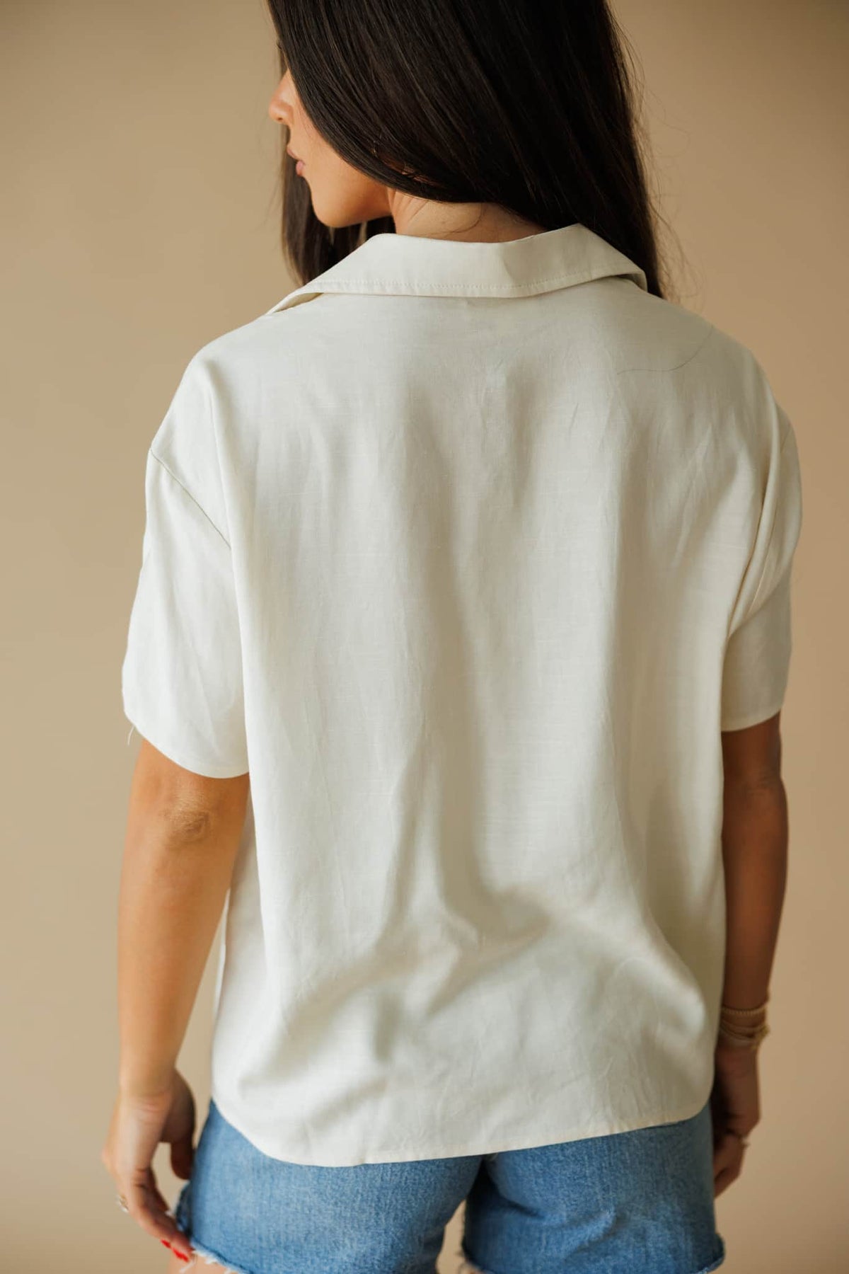 The Coastline Shirt in cream, back view showing the boxy short sleeve shirt