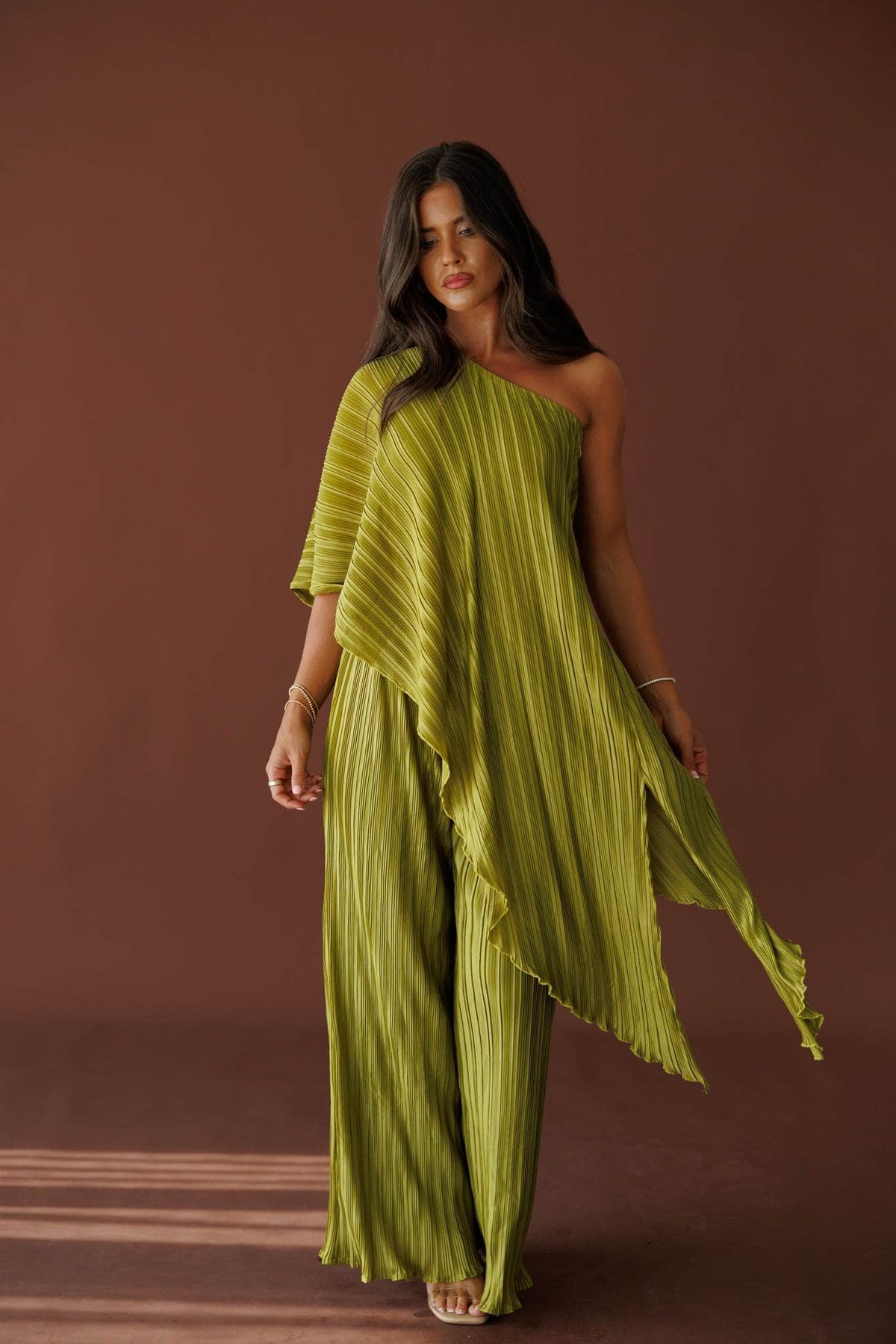 Muse Moments Pleated Pants in olive, full-length view with the matching pleated cape top