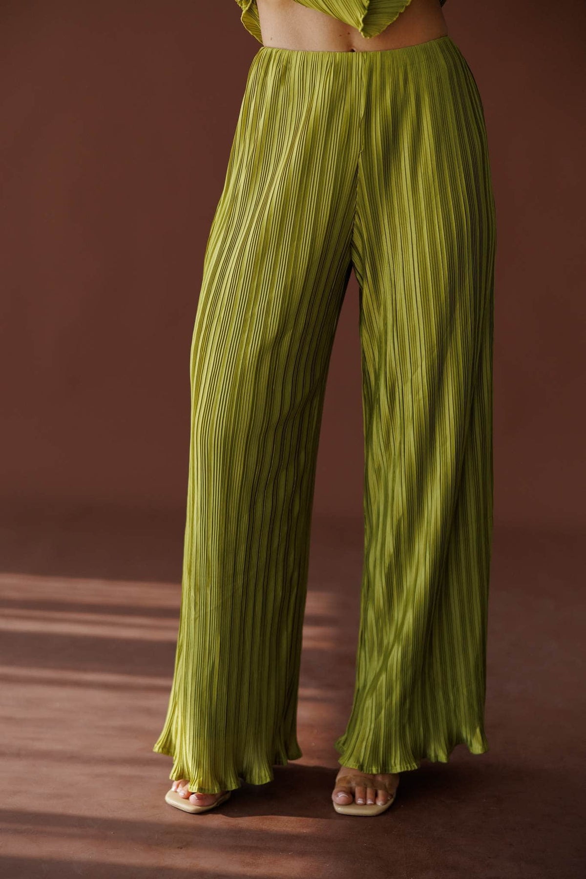 Muse Moments Pleated Pants in olive, front close-up of the pleated wide leg