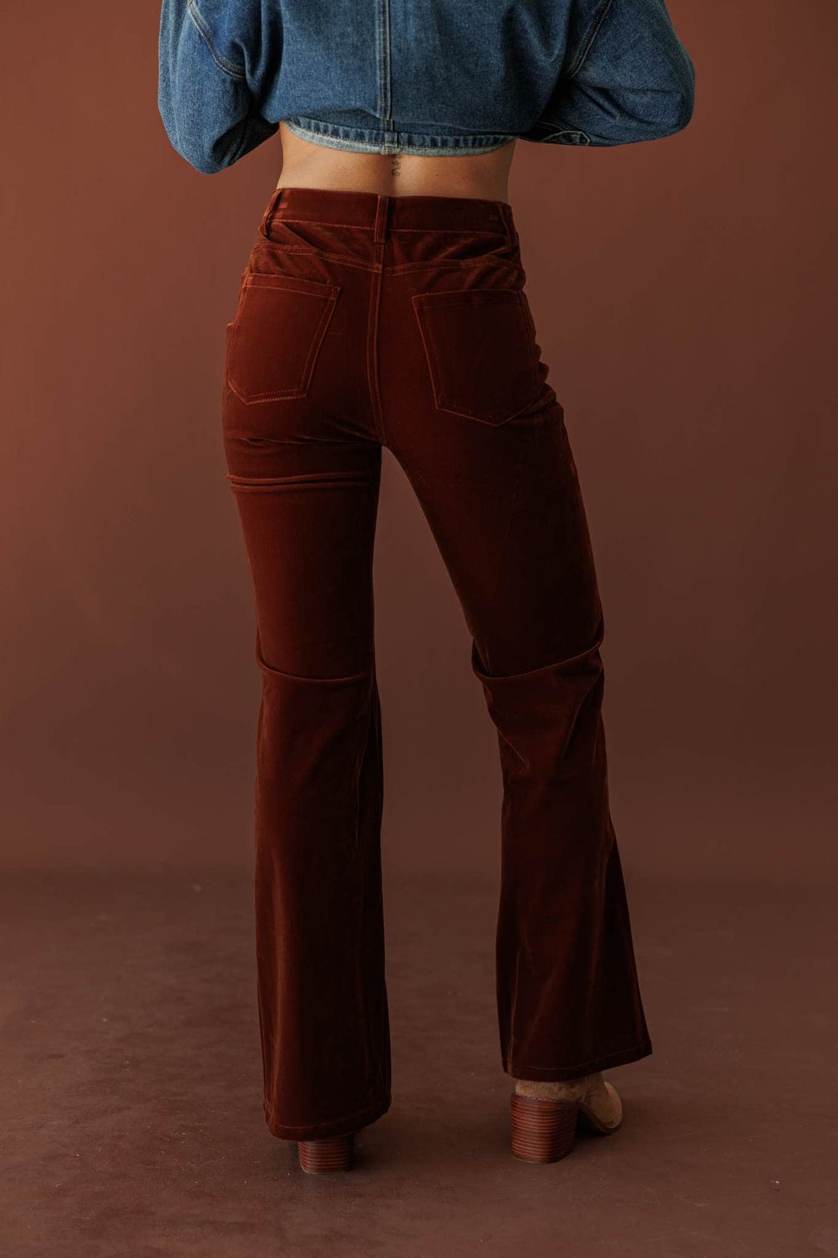 After Dark Velvet Flare Pants, in mulberry, front view of the flared leg