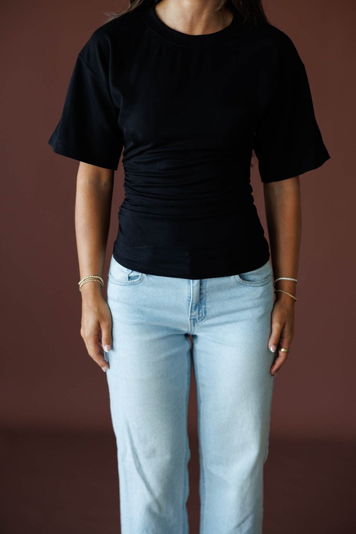 One Sided Ruched Tee in black, close-up of the ruched side seam and short sleeve