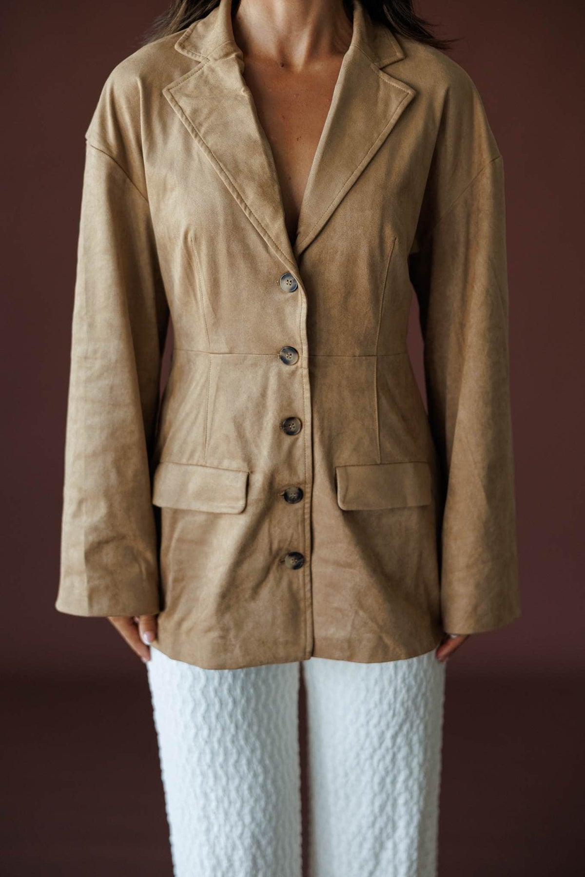 Paddock Suede Blazer in light brown, front close-up of the lapel collar and button front