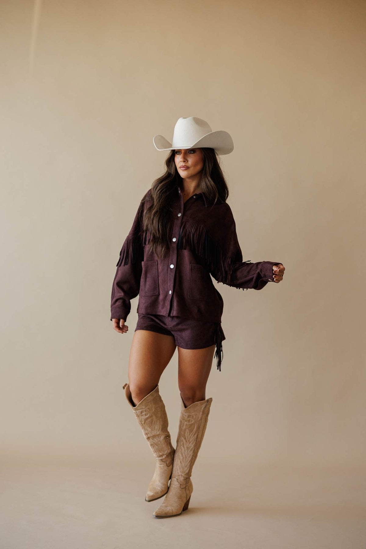 Dark brown suede jacket with fringe, front view