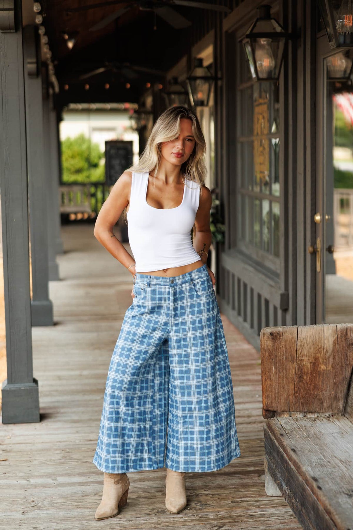Plaid Denim Cropped Wide Leg Pants in denim plaid, full-length view on a covered porch