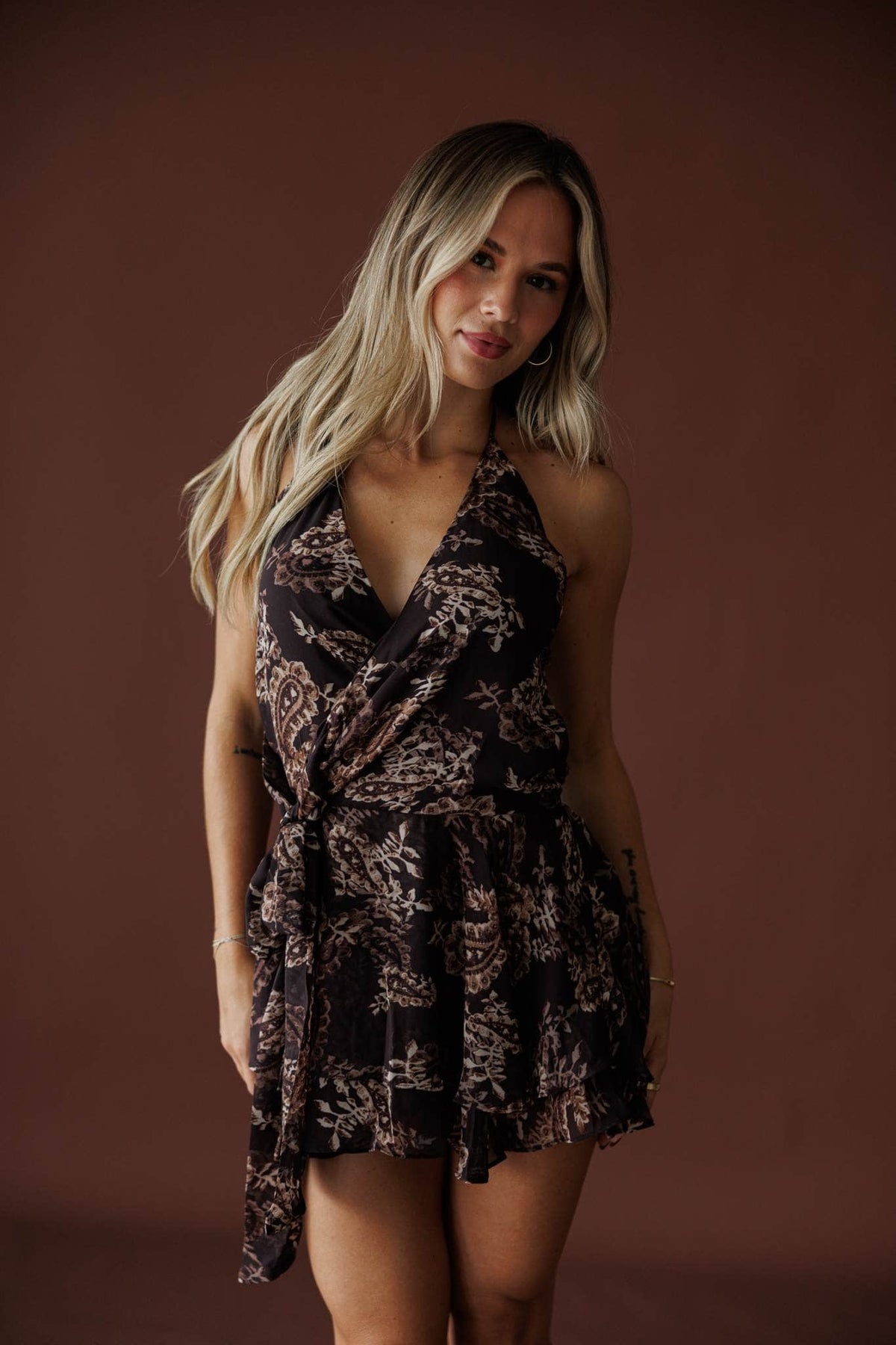 Paisley Nights Halter Dress in brown paisley, front view showing the halter neck mini dress