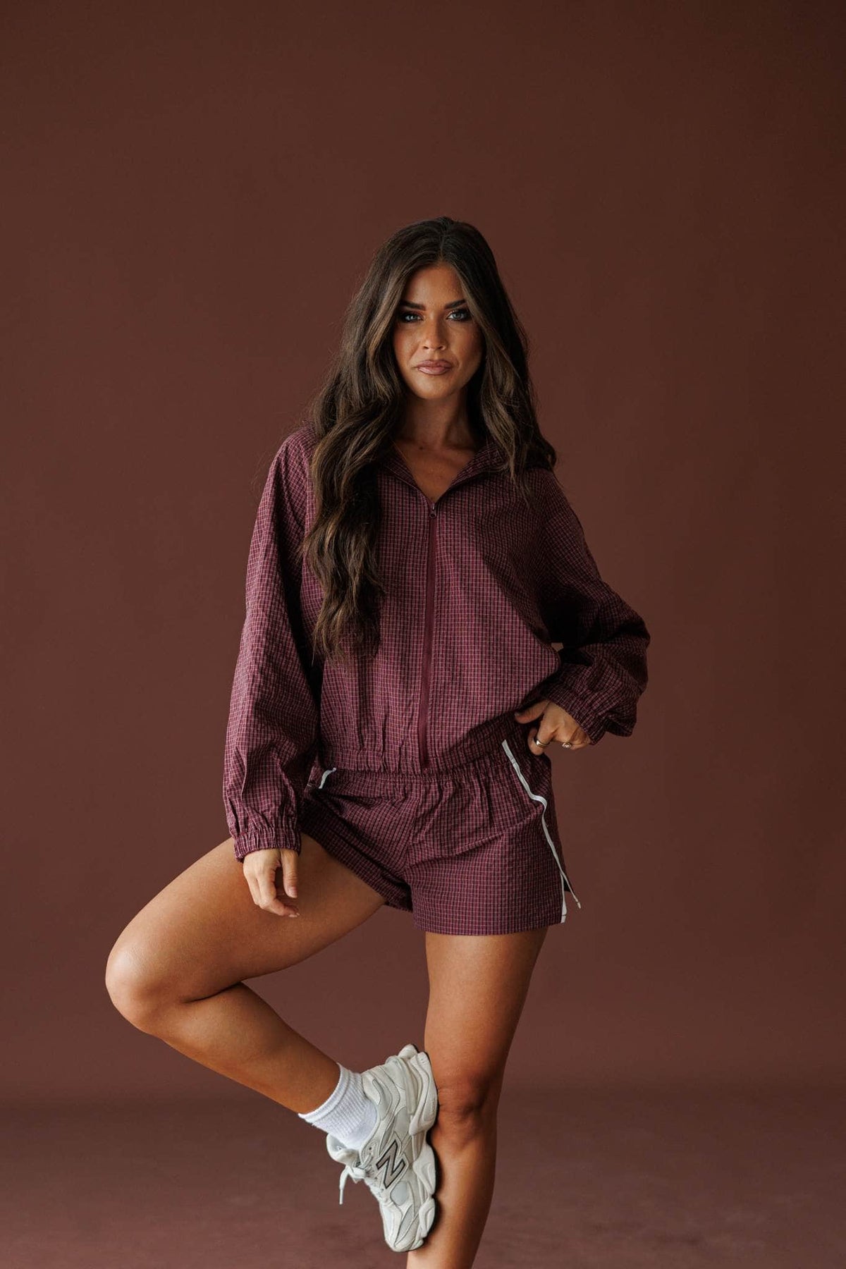 Off Duty Track Shorts in burgundy, full-length view with the matching hooded jacket