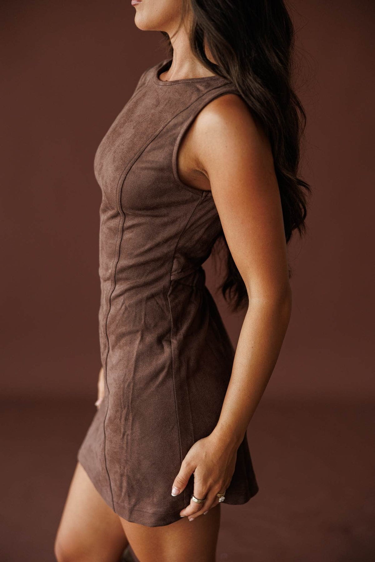 Saddle Up Suede Mini Dress in chocolate, side view showing the fitted suede mini dress