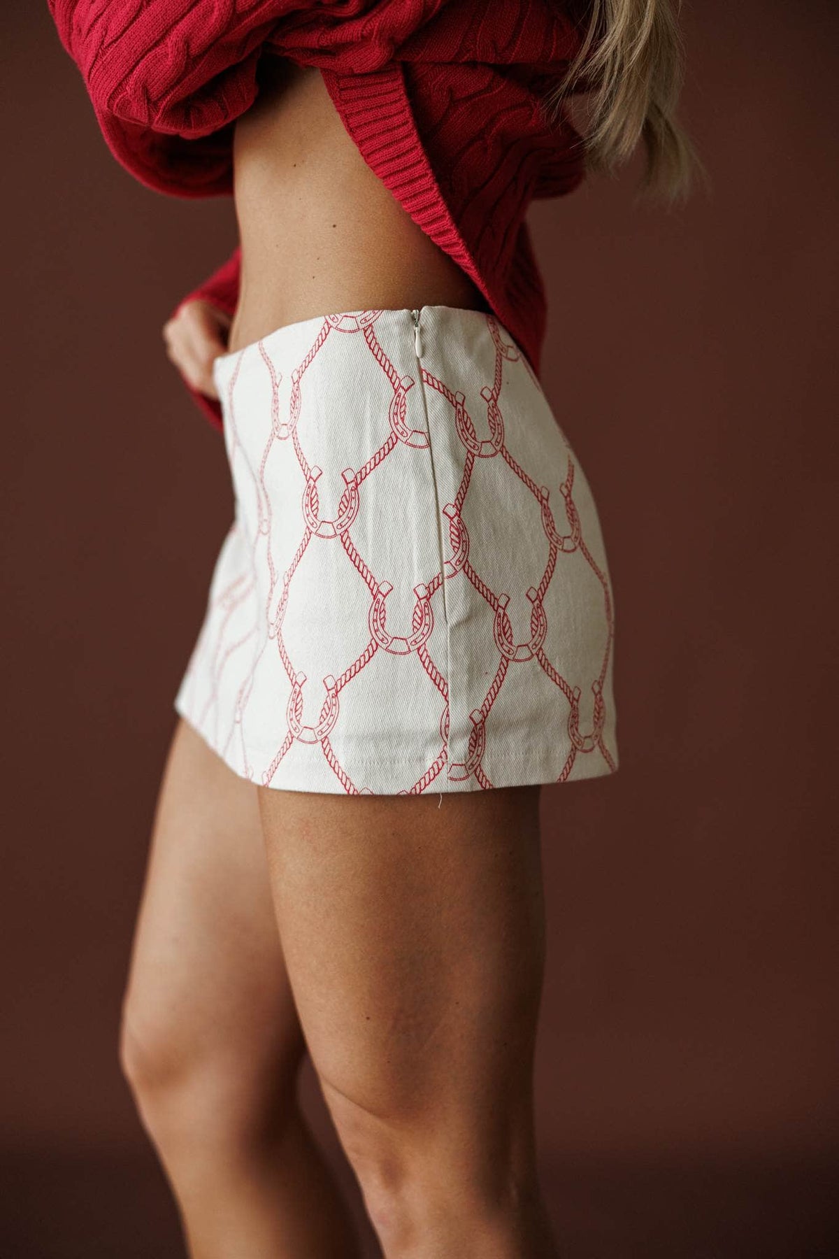 Quilted Sweetheart Mini Skirt in ecru, side view showing the high rise quilted mini